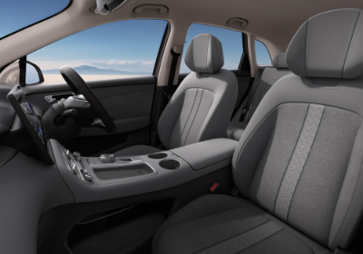 Front seats and dashboard of a modern car interior.