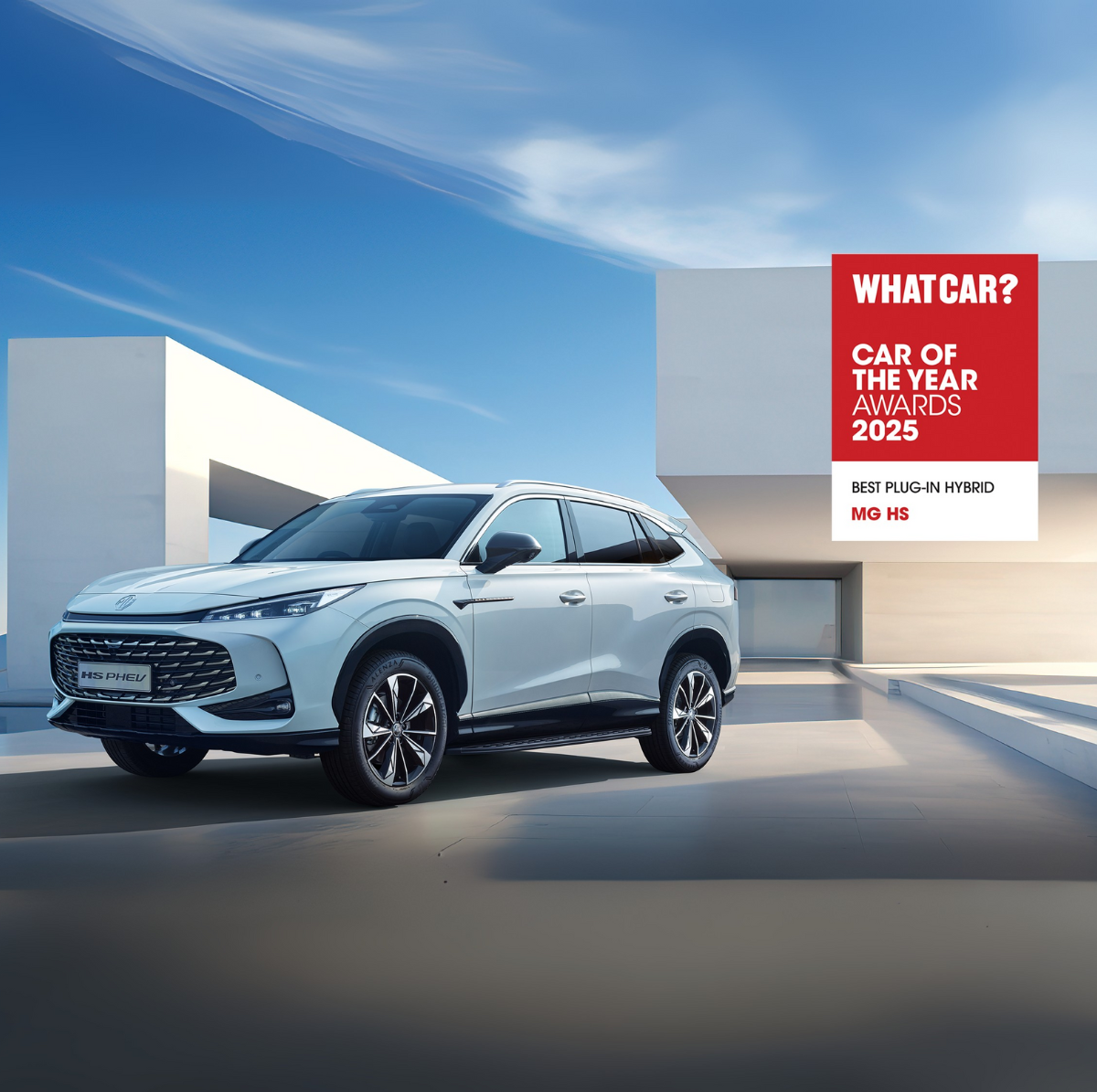 White MG HS car with 'Best Plug-in Hybrid' award from What Car? 2025 displayed.